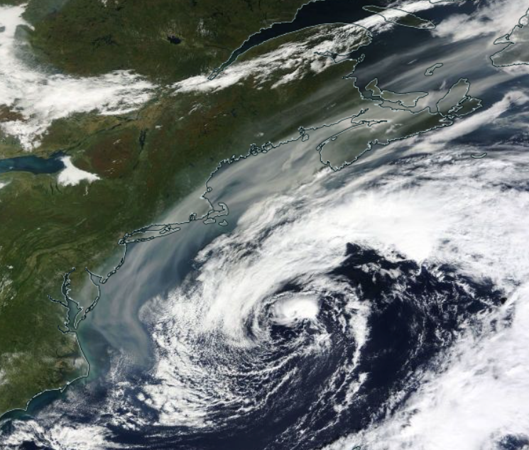 Figure 4. Smoke (gray shading) circulating around the back side of an offshore low on the morning of October 1st (NASA Terra). Smoke (gray shading) circulating around the back side of an offshore low on the morning of October 1st (NASA Terra).