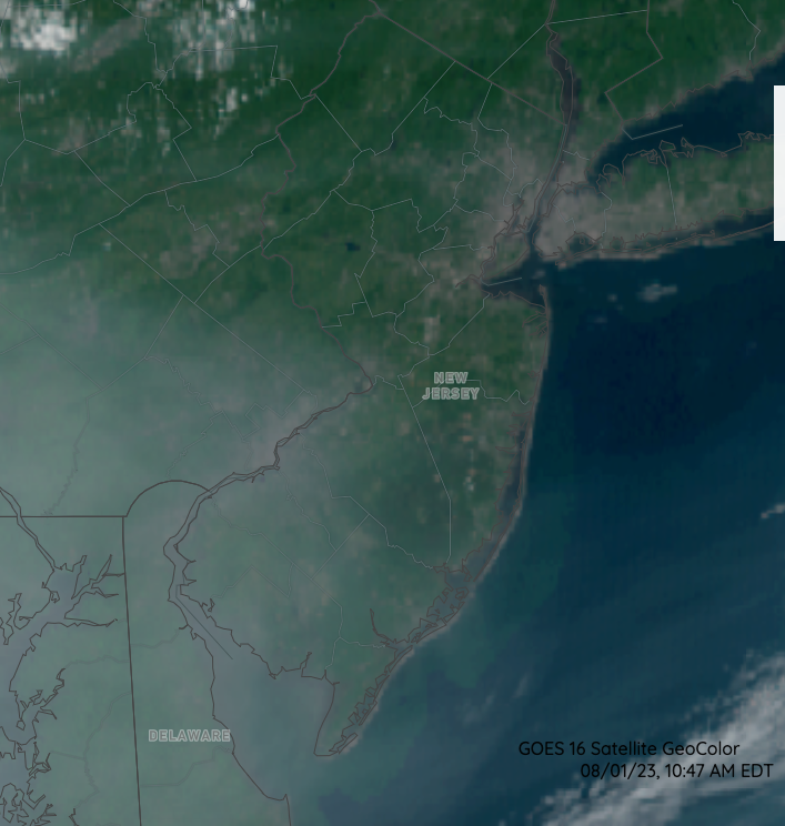 Figure 10. Visible satellite image at 10:47 AM on August 1st showing the high-altitude smoke veil over southern NJ and adjacent southeast PA, northeast MD, and north DE, Delaware Bay, and in the adjacent Atlantic (NOAA GOES image). Visible satellite image at 10:47 AM on August 1st showing the high-altitude smoke veil over southern NJ and adjacent southeast PA, northeast MD, and north DE, Delaware Bay, and in the adjacent Atlantic (NOAA GOES image).