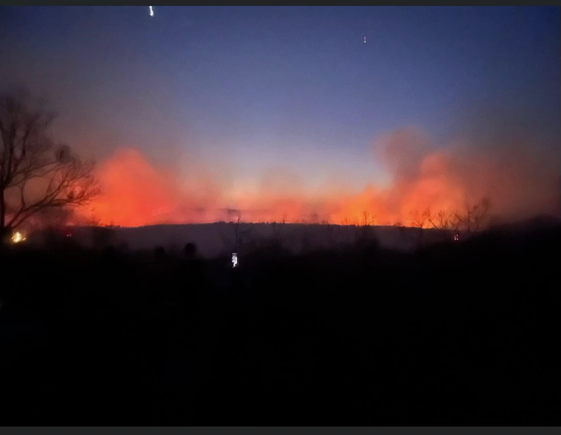 Figure 4. Evening photo of the West Milford wildfire on April 12th (source unknown). Evening photo of the West Milford wildfire on April 12th (source unknown).