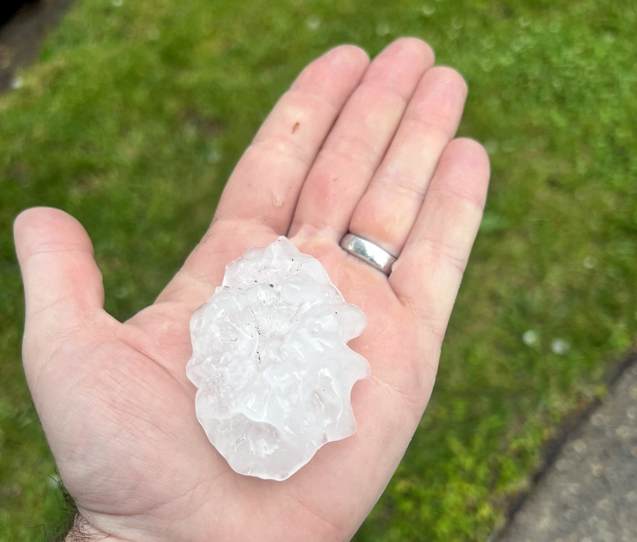 A large hailstone of approximately 2.5 inches in diameter from a severe thunderstorm in Cherry Hill (Camden County) on May 20th. Photo by Chip Murphy (<a href="https://twitter.com/ChipMurphy/status/1527754384150495232" style="font-size: 10px" target="_blank">@ChipMurphy</a>). Large hailstone from severe thunderstorm in Cherry Hill on May 20.
